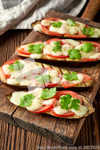 Image of Baked eggplant with tomatoes and cheese