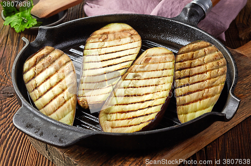 Image of grilled eggplants on cooking pan