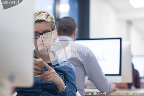 Image of startup business, woman  working on desktop computer