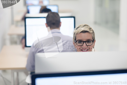 Image of startup business, woman  working on desktop computer