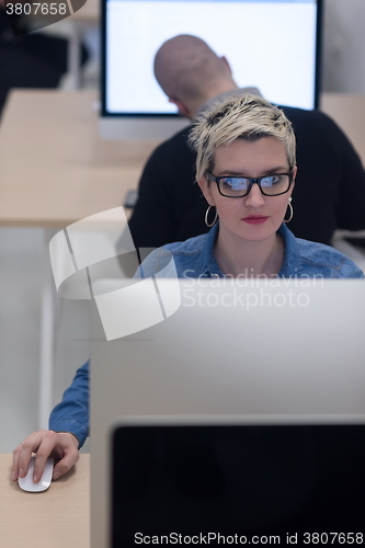 Image of startup business, woman  working on desktop computer