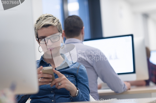 Image of startup business, woman  working on desktop computer