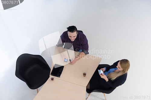 Image of aerial view of business people group on meeting