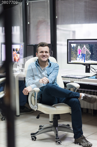 Image of photo editor at his desk