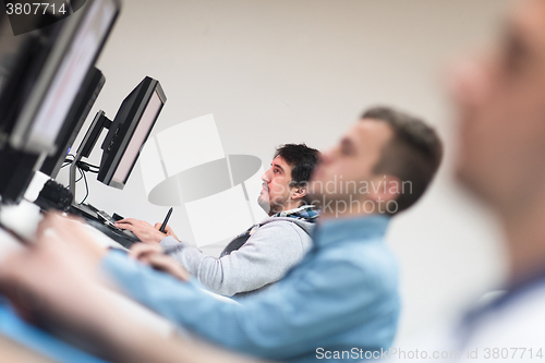 Image of photo editors on work