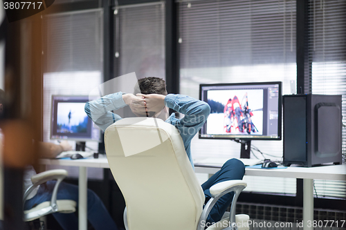 Image of photo editor at his desk