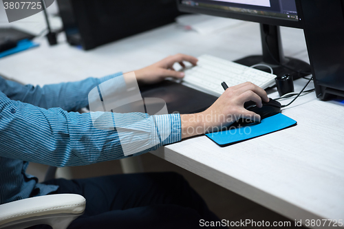 Image of photo editor at his desk