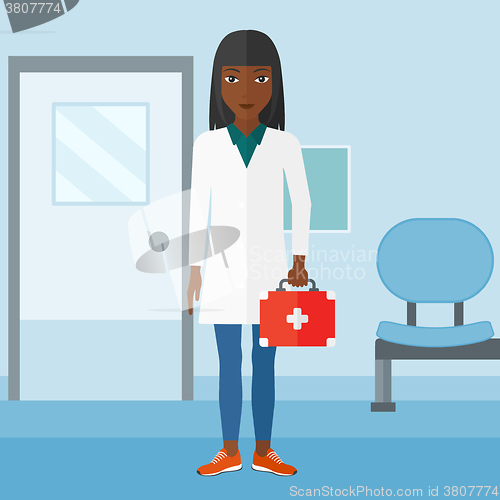 Image of Doctor with first aid box.