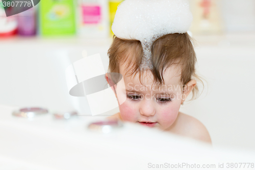 Image of little girl taking spa bath