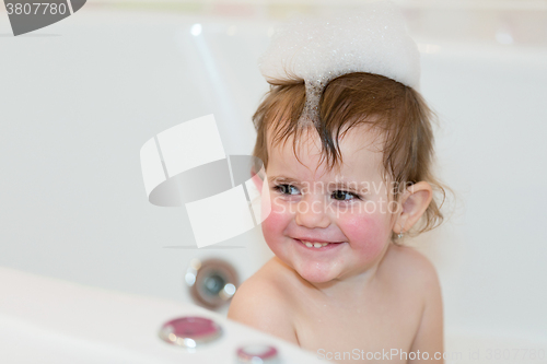 Image of little girl taking spa bath