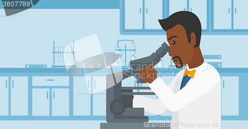 Image of Laboratory assistant with microscope.
