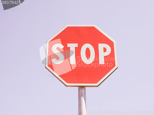 Image of  Stop sign over blue sky vintage