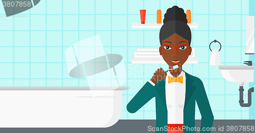 Image of Woman brushing teeth.