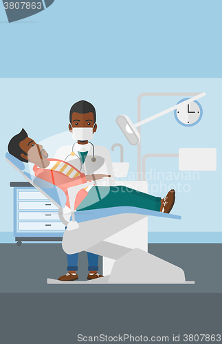 Image of Dentist and man in dentist chair.