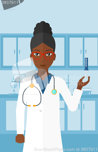 Image of Doctor with syringe in laboratory.