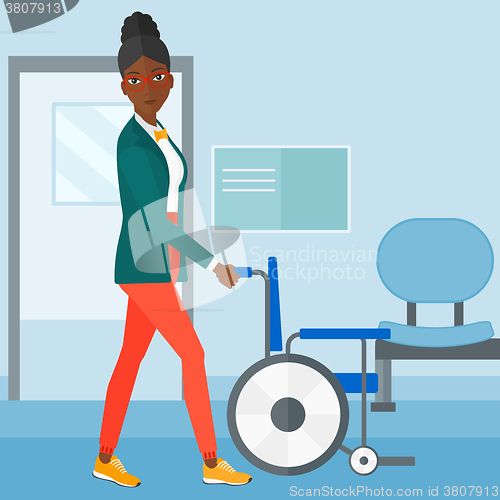 Image of Woman pushing wheelchair.