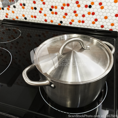 Image of Metal saucepan on a stove