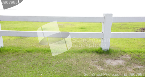 Image of white fence and grass