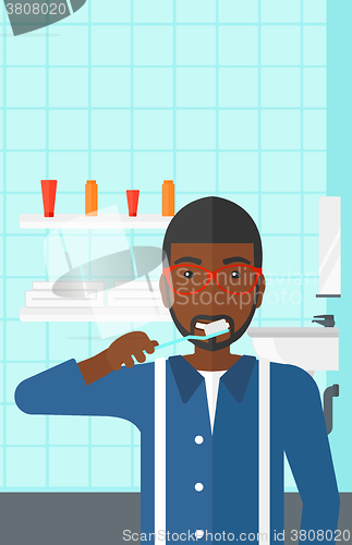 Image of Man brushing teeth.