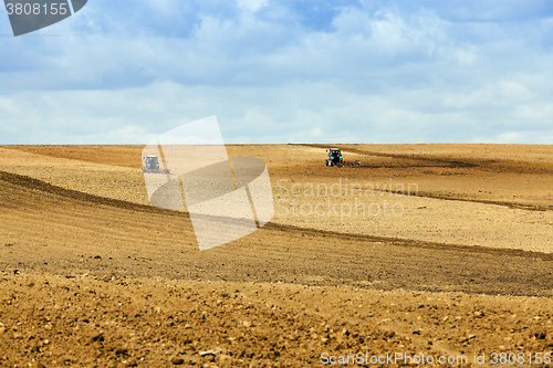 Image of tractor plowing the fields  