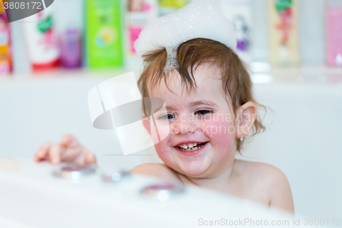 Image of little girl taking spa bath