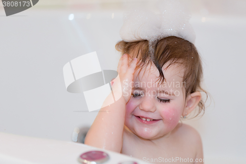 Image of little girl taking spa bath