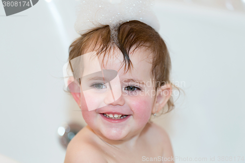 Image of little girl taking spa bath