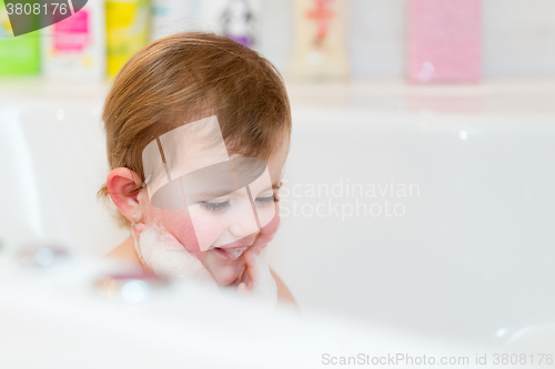 Image of little girl taking spa bath