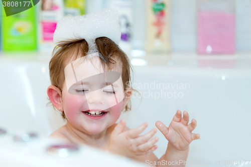 Image of little girl taking spa bath