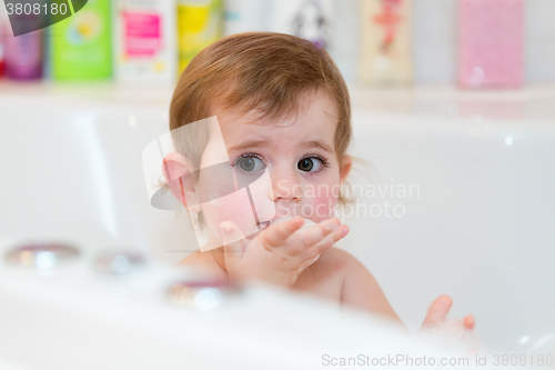 Image of little girl taking spa bath
