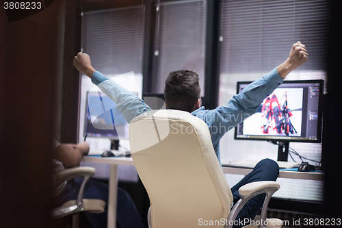 Image of photo editor at his desk