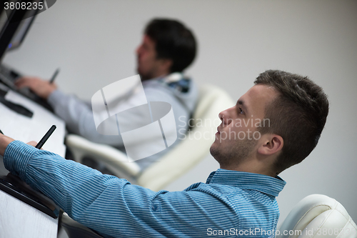 Image of photo editor at his desk