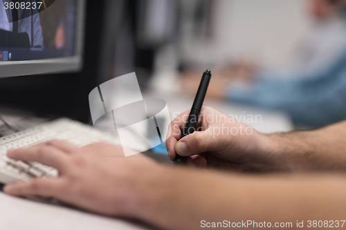 Image of photo editors on work