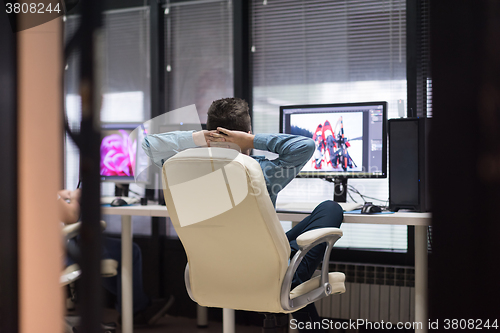 Image of photo editor at his desk