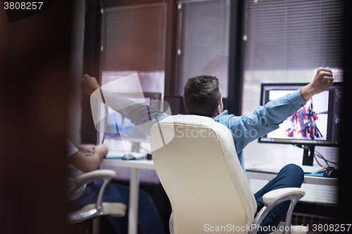 Image of photo editor at his desk