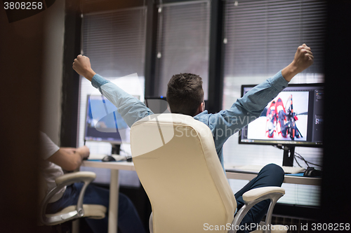 Image of photo editor at his desk