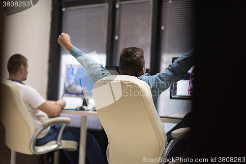 Image of photo editor at his desk