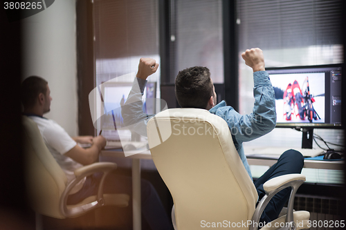 Image of photo editor at his desk