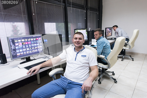 Image of photo editor at his desk