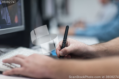 Image of photo editors on work