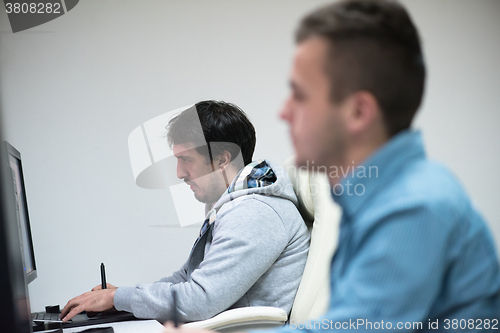 Image of photo editor at his desk