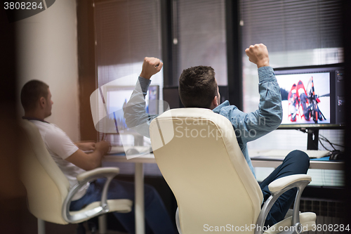 Image of photo editor at his desk