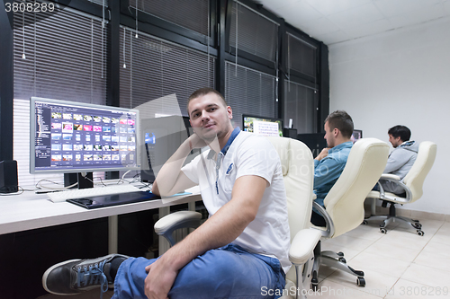 Image of photo editor at his desk