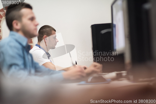 Image of photo editors on work