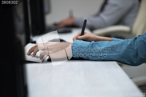 Image of photo editor at his desk