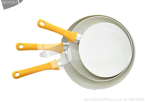 Image of Set of three frying pans, yellow