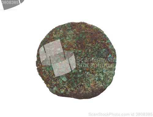 Image of Unrecognisable old coin, rusted and green, isolated