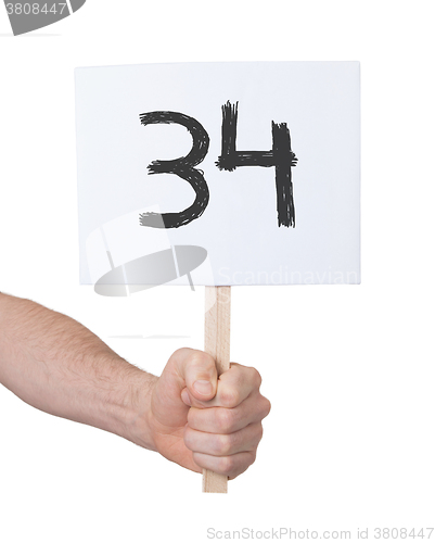 Image of Sign with a number, 34