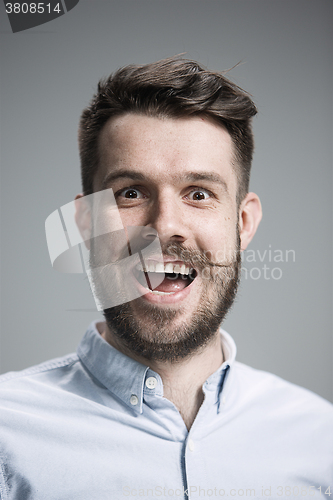 Image of The  young man looking at camera 