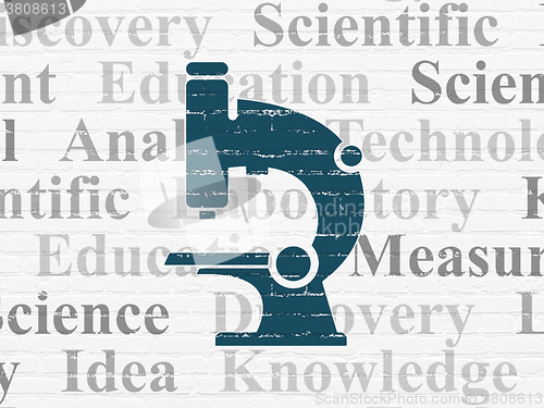 Image of Science concept: Microscope on wall background